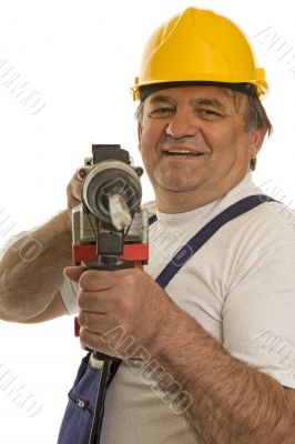 Worker with drilling machine and safety helmet
