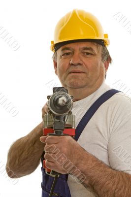Worker with drilling machine and safety helmet Worker with drilling machine and safety helmet