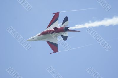 Fighter jet with contrail