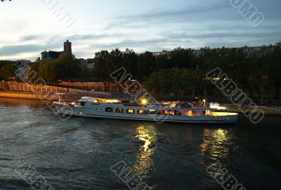 Pleasure craft on Seine, Paris, at night