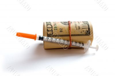 A roll of dollars with syringe