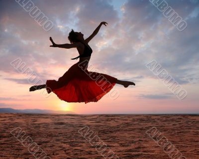 Jumping woman at sunset Jumping woman at sunset