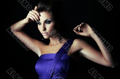 sexy brunette fashion girl in violet dress - portrait
