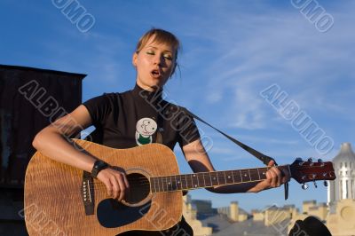 The young musician over a city