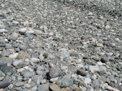 a gray pile of rounded rocks