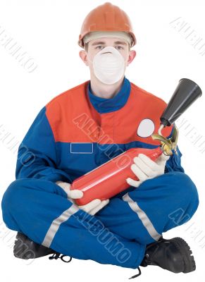 Man in overllas and fire-extinguisher