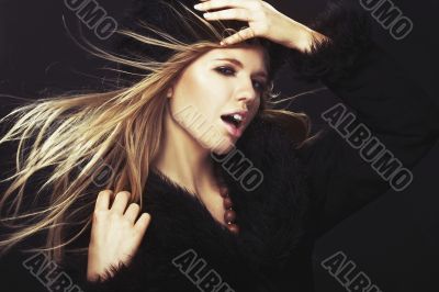 Woman in black fur hat and coat Woman in black fur hat and coat