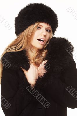 Woman in black fur hat and coat