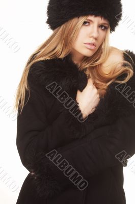 Woman in black fur hat and coat