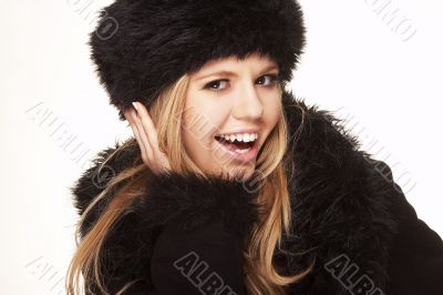 Woman in black fur hat and coat