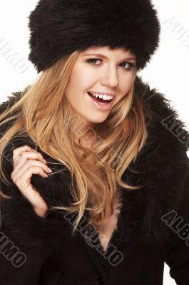 Woman in black fur hat and coat