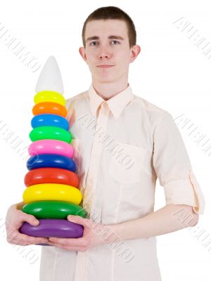 Young man and toy pyramid