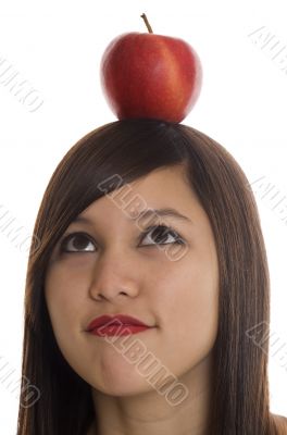 Teenager with apple at the head