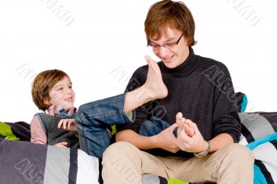 Older brother is tickling the young one