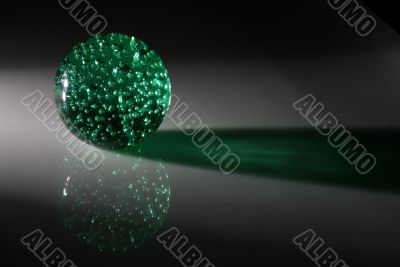 A green sphere with reflection