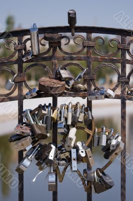 Locks of a newly-married couple on lovers bridge