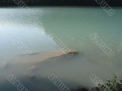 green lake and rocks