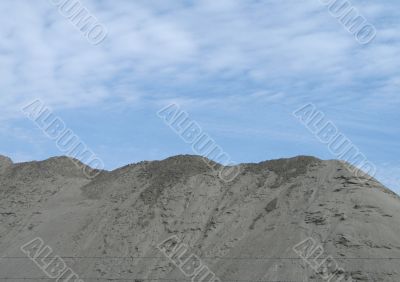 dirt pile and blue sky dirt pile and blue sky