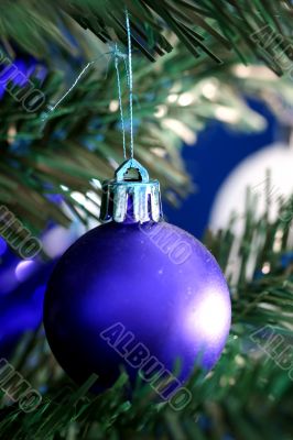 Christmas ornaments on tree.
