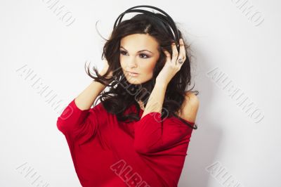 Young beautiful happy women listening music in headphones