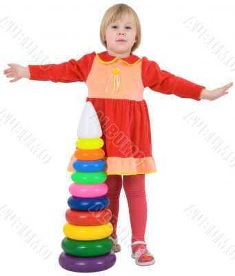 Little girl and toy pyramid