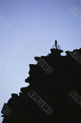 Mountain Biker Atop Cliff in Colorado
