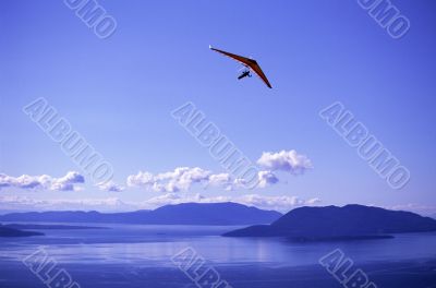 Hang glider Against Blue Skies Hang glider Against Blue Skies