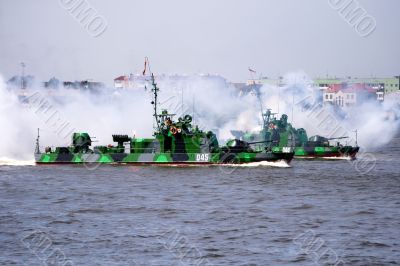 Military ship is shooting