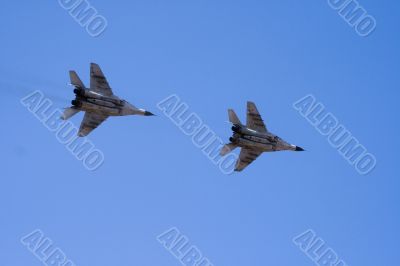 Military jets flying through the sky