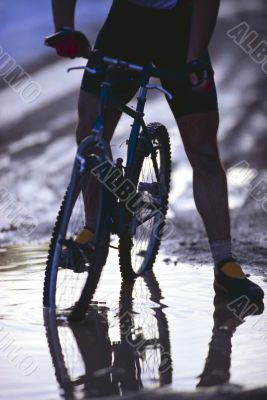 Biker In Puddle