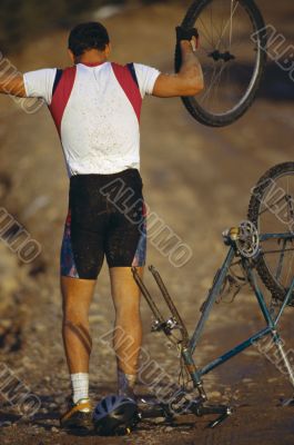 Man with Broken Mountain Bike