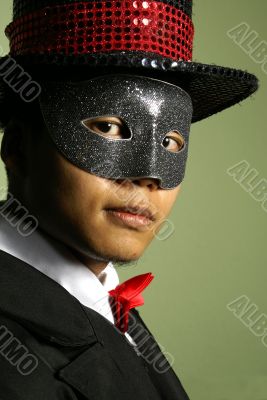 Masked performer portrait with top hat