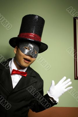 Man in mask and top hat surprise