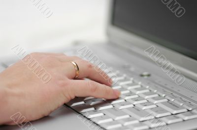 selective focus hand on alptop