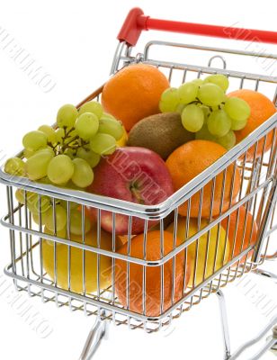 Shopping trolley with fruits, supermarket