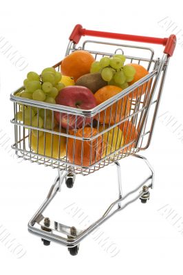 Shopping trolley with fruits, supermarket