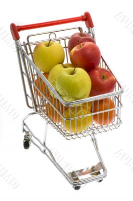 Shopping trolley with fruits, supermarket