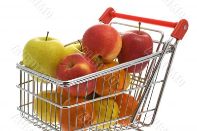 Shopping trolley with fruits, supermarket