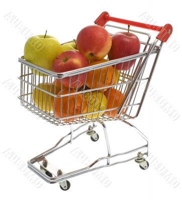 Shopping trolley with fruits, supermarket