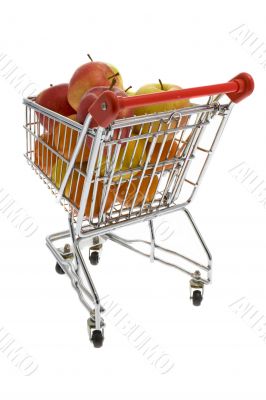 Shopping trolley with fruits, supermarket