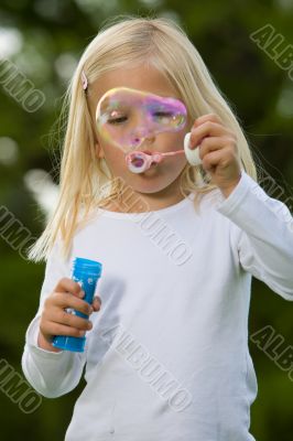 Blowing a giant soapbubble