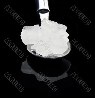 crystal sugar on a spoon