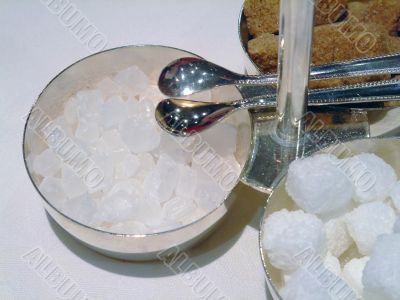 Candy sugar cubes with tongs