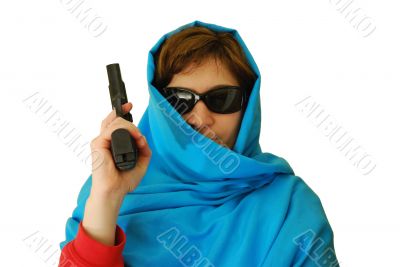 woman in east clothes holds handgun