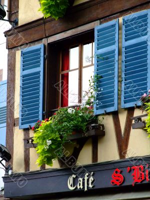 Window over  french cafe in Alsace