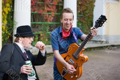Two young men dance in the street