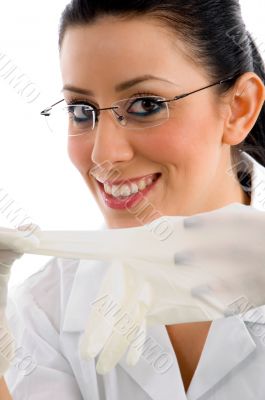 close view of smiling doctor wearing gloves