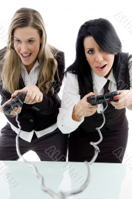 female partners playing game and holding remote