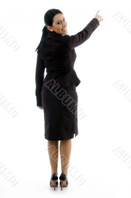 back pose of businesswoman indicating