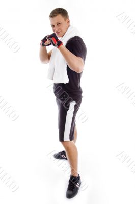 standing adult man showing fists